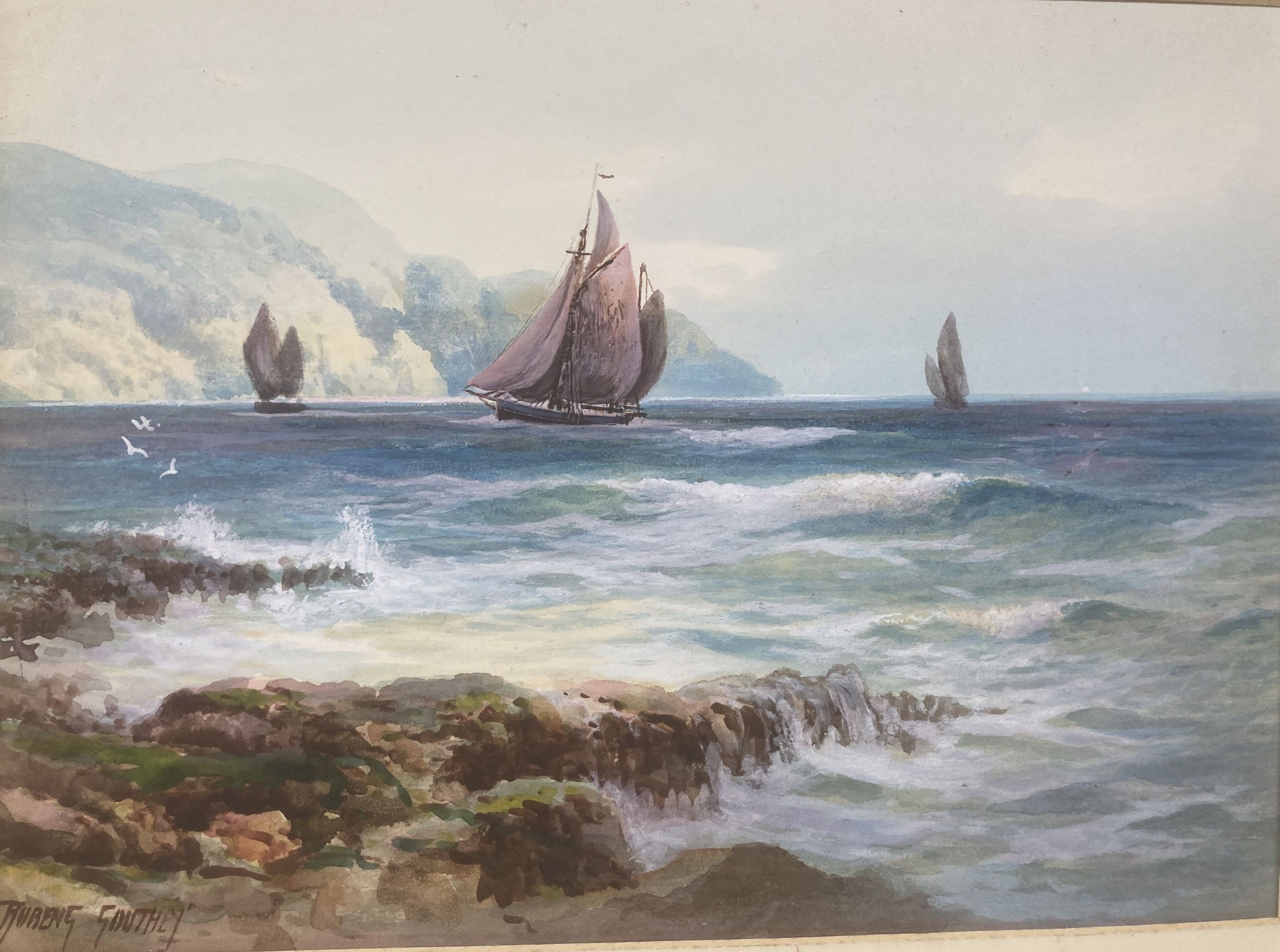 Rubens Southey (1881-1933), watercolour, Fishing boats along the coast, signed, 25 x 35cm, unframed